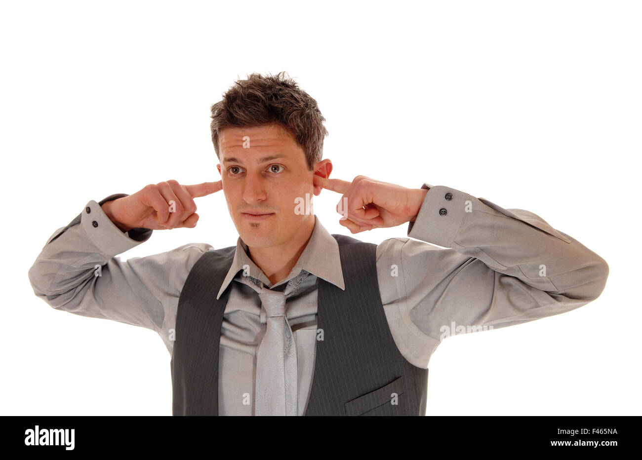 Man with finger in ear's Stock Photo Alamy