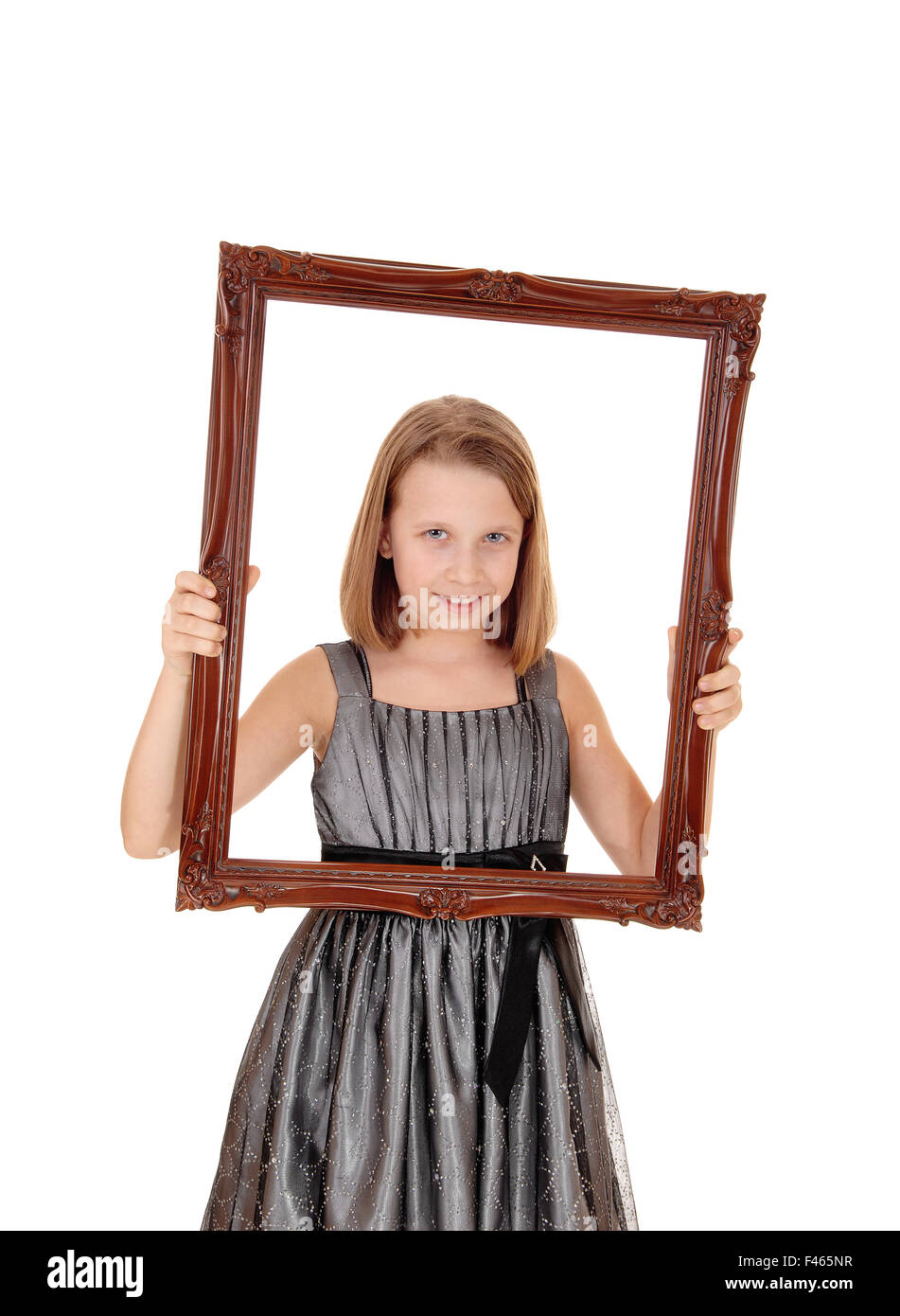 Pretty girl holding picture frame. Stock Photo