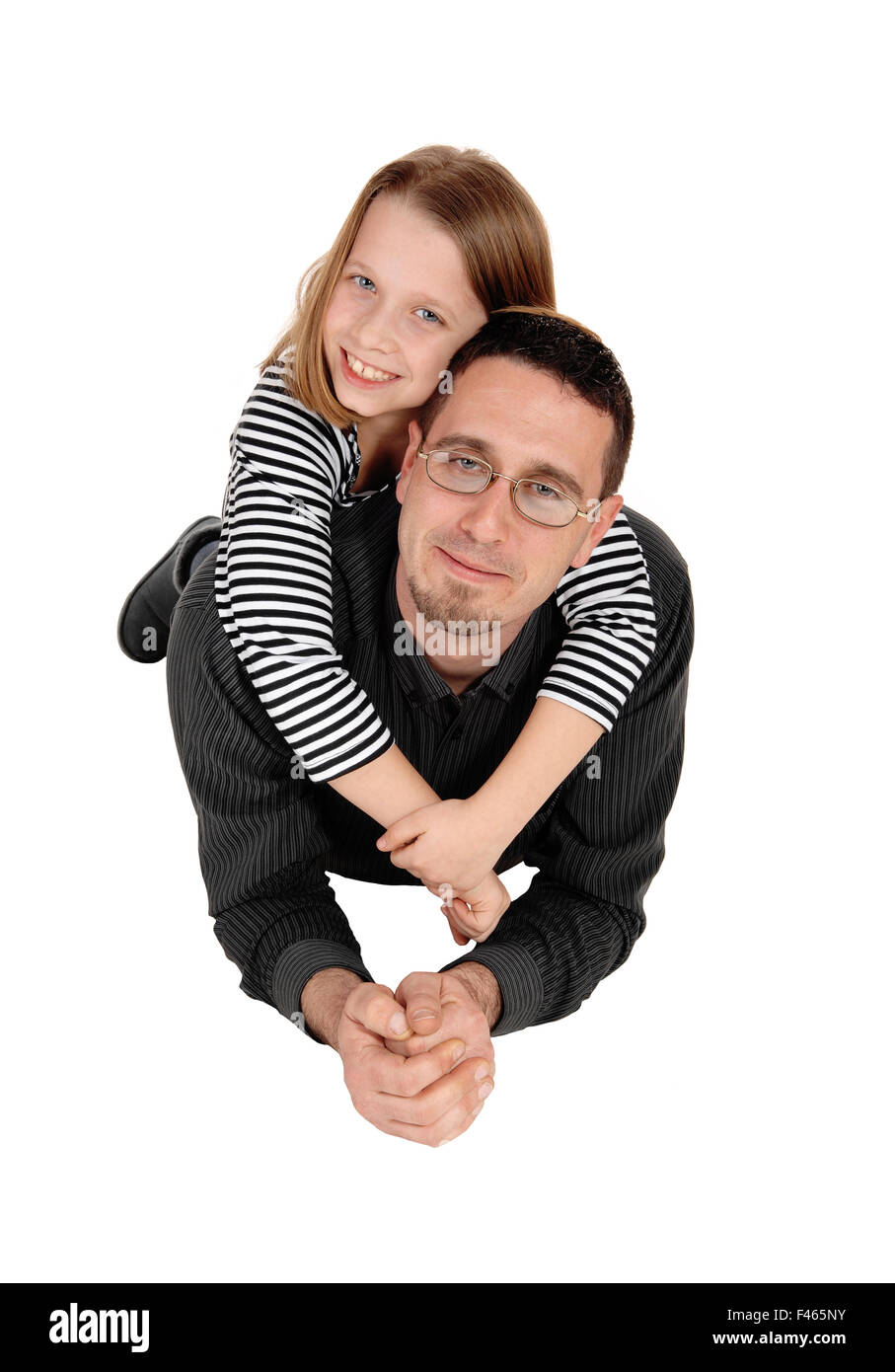 Daughter piggyback on dad. Stock Photo