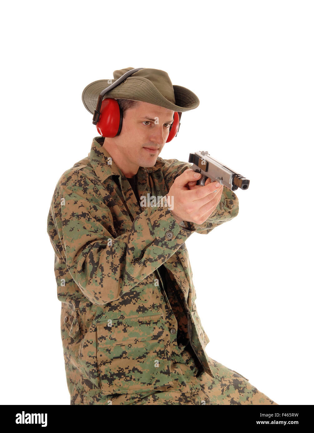 Soldier pointing a pistol. Stock Photo