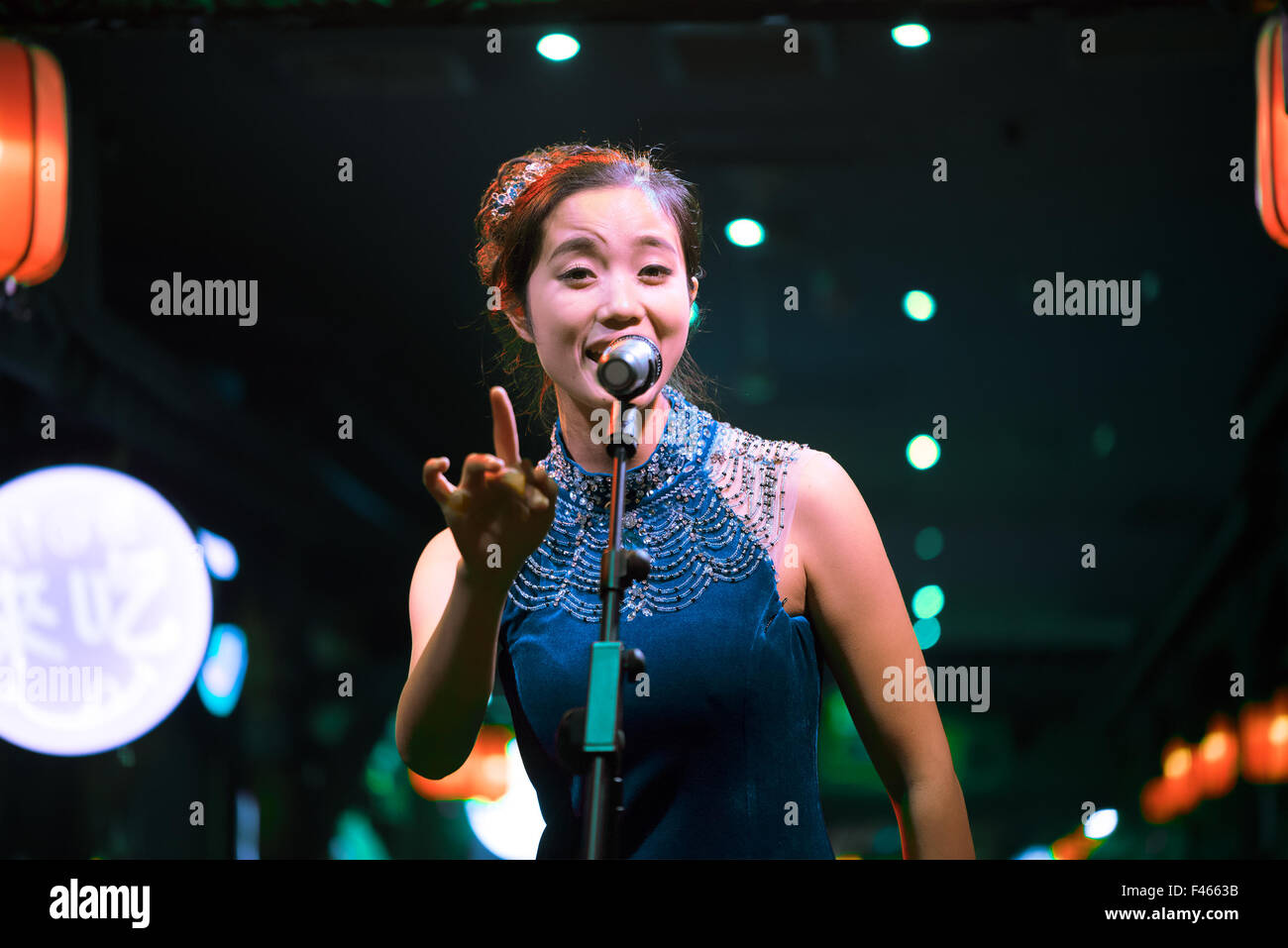 Chengdu, Sichuan Province, China - September 18, 2015: Chinese female artist sings traditional chinese song on stage Stock Photo