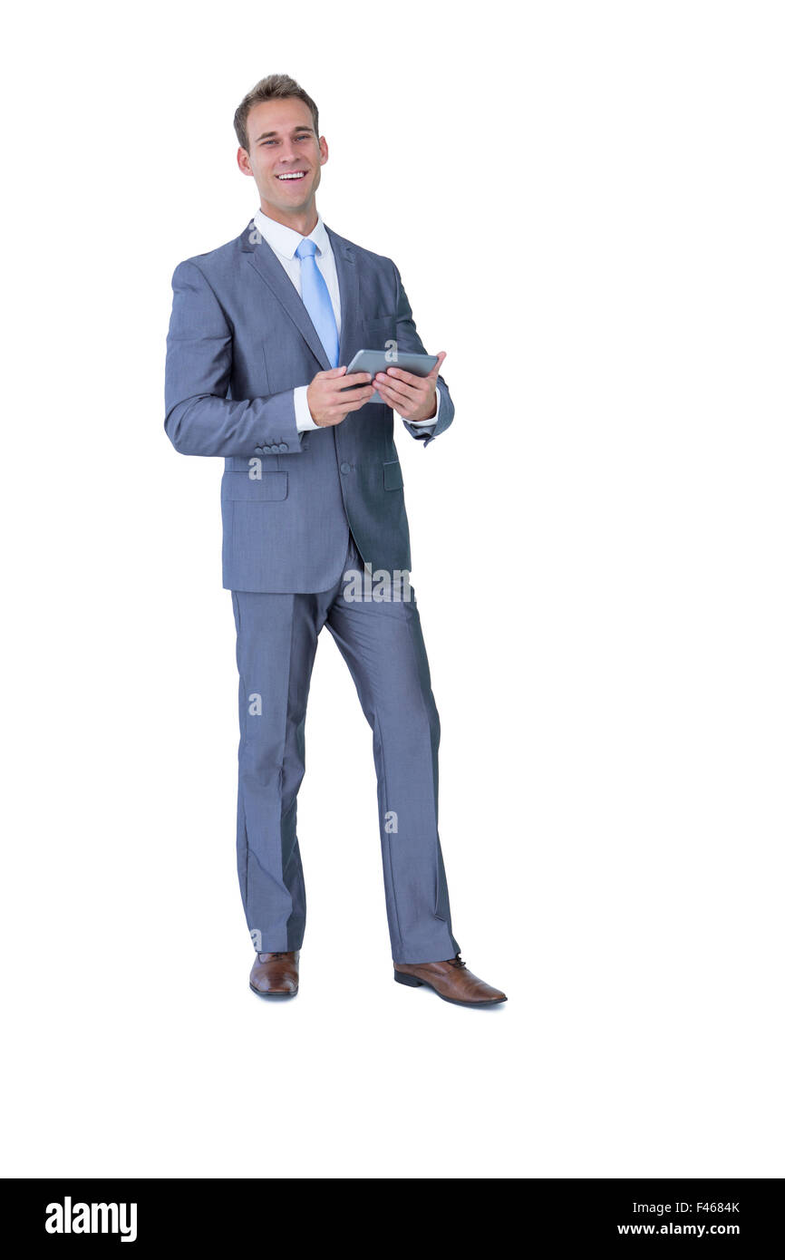Happy businessman holding tablet computer Stock Photo