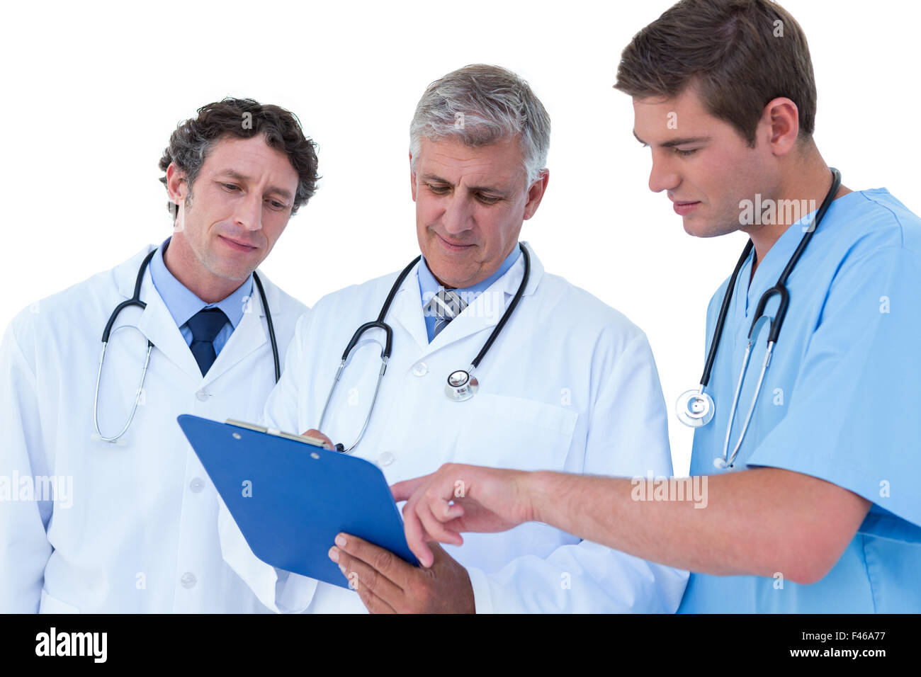 Doctors and nurse discussing over notes Stock Photo - Alamy