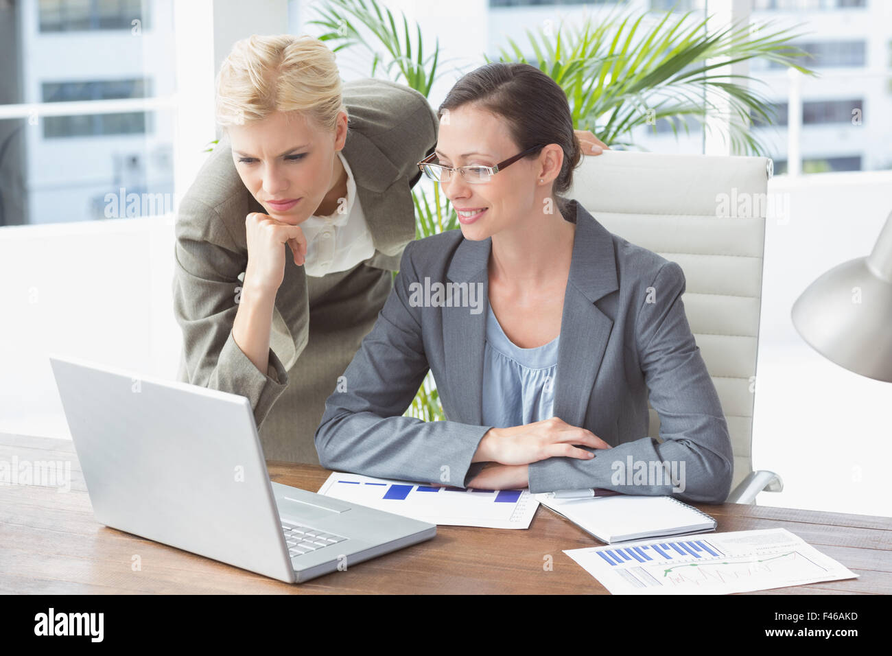 Businesswomen working together Stock Photo - Alamy