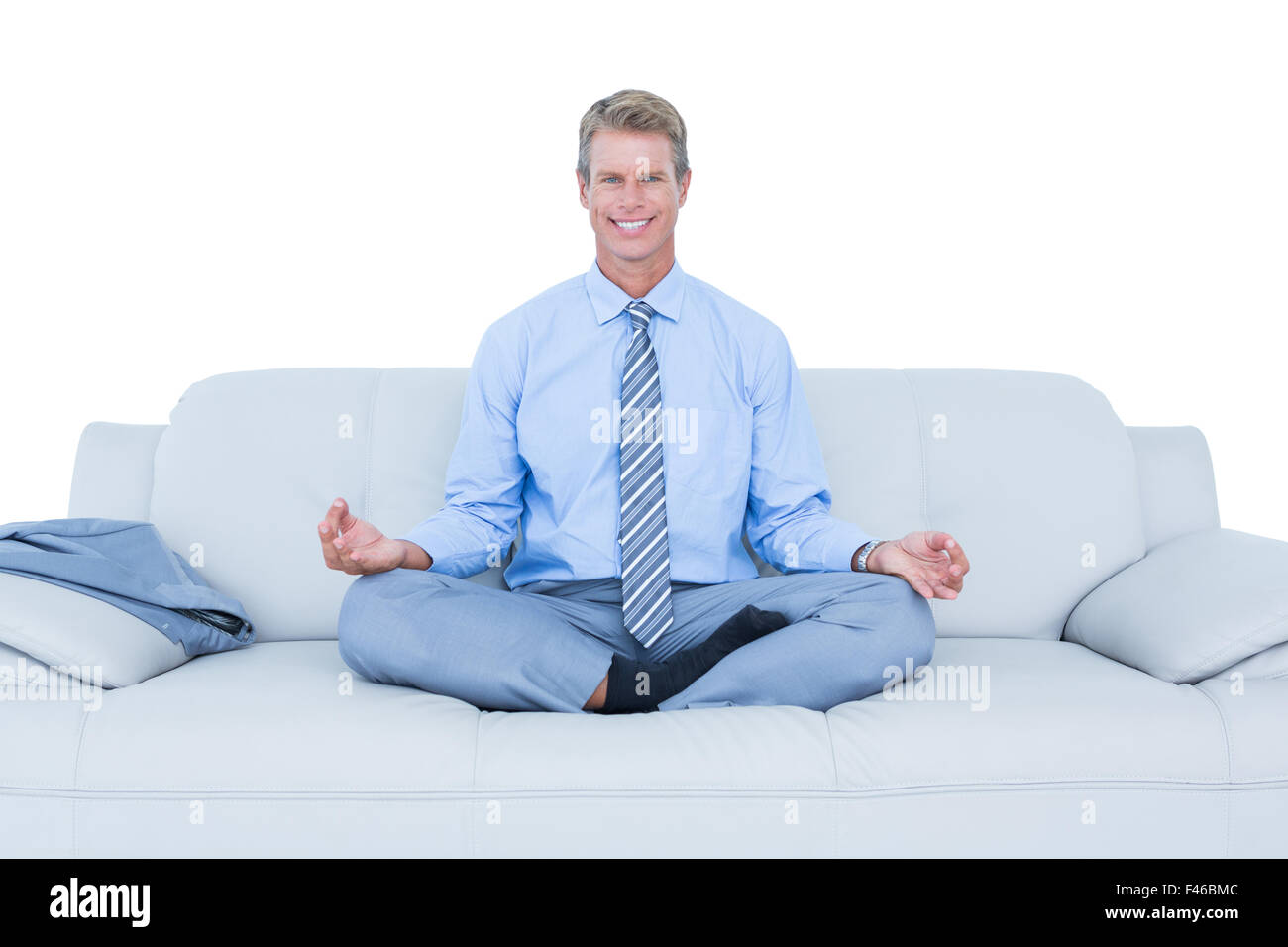 businessman meditating in yoga pose Stock Photo - Alamy