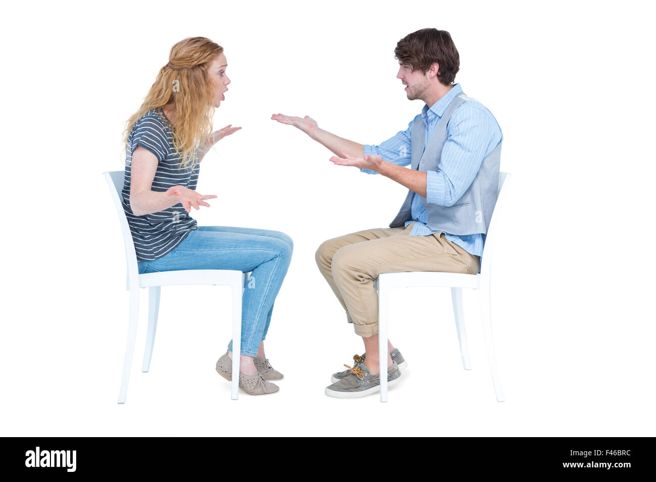 Sitting couple having an argument Stock Photo - Alamy