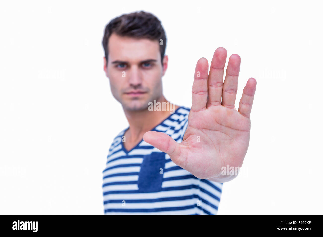 Hand On Stop Sign Rapper Handsome hipster showing stop sign with hand Stock Photo - Alamy