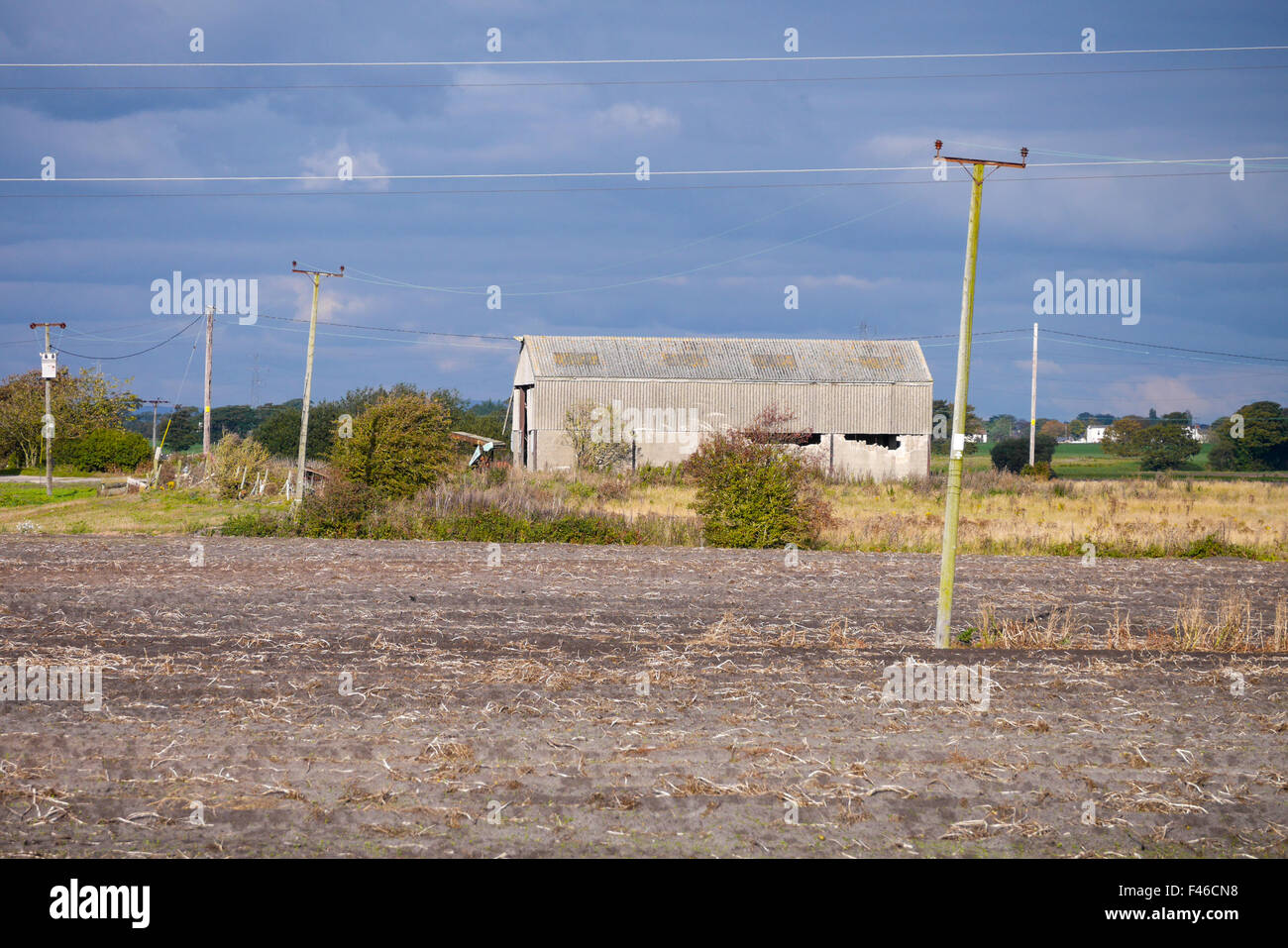 Late Rural England A rural scene in West Lancashire England showing an old barn lit by the ...