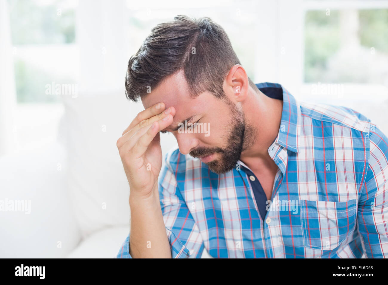 Ill man suffering from headache Stock Photo