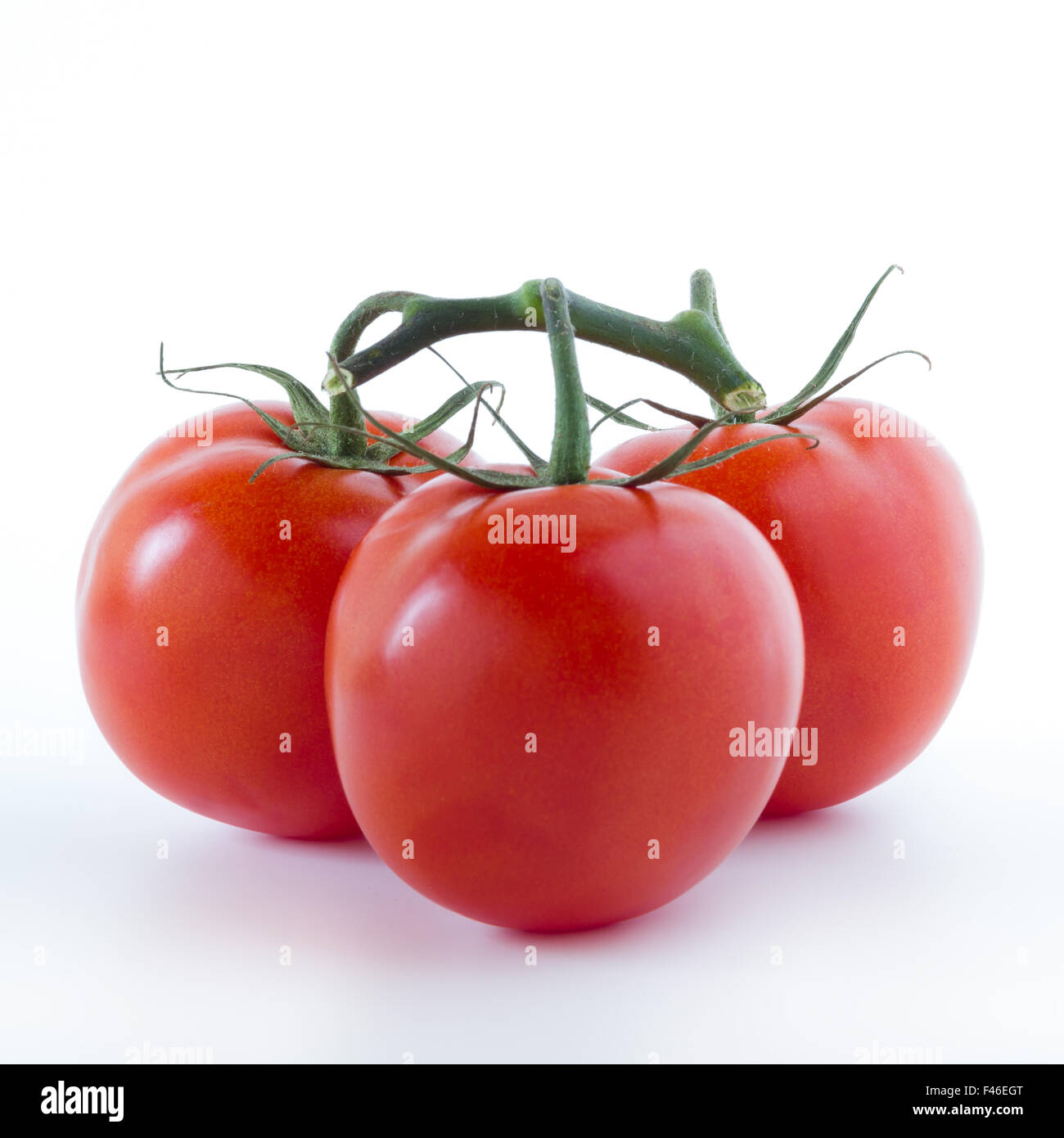 Three ripe tomatoes, isolated on white background Stock Photo - Alamy