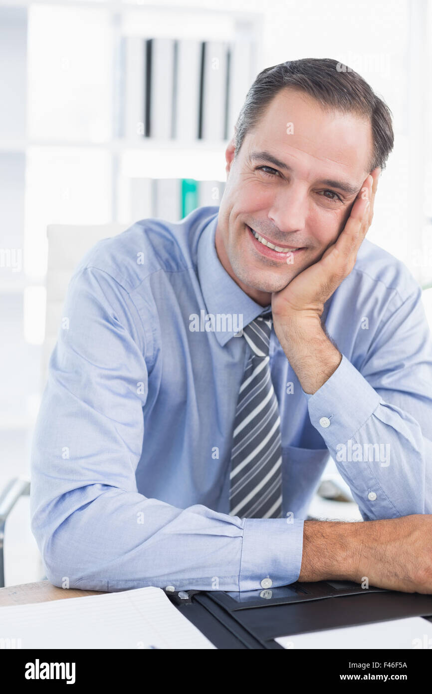 Smiling businessman looking at camera Stock Photo - Alamy