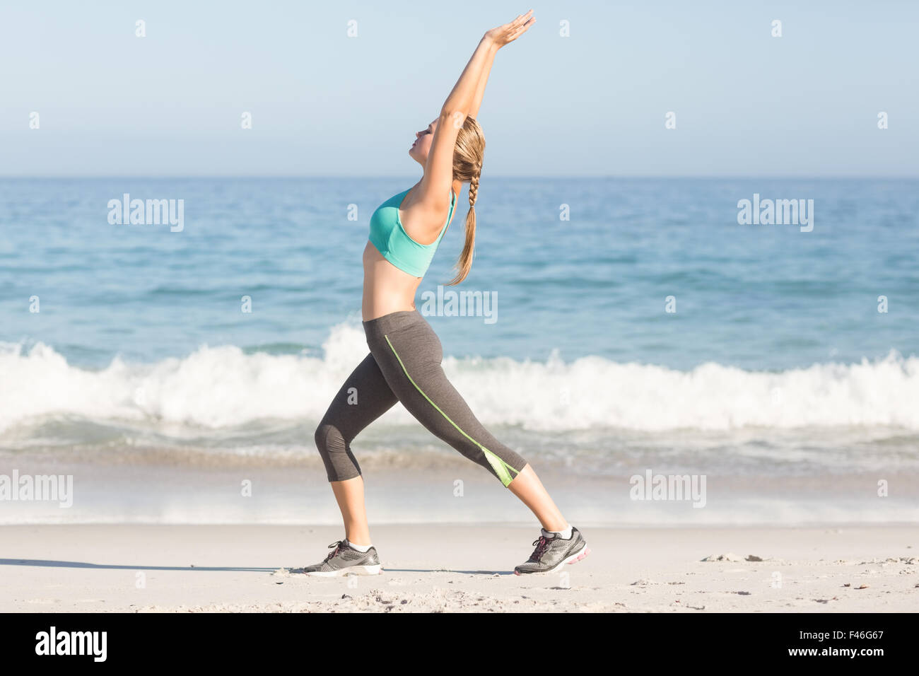 Fit woman stretching her back Stock Photo - Alamy