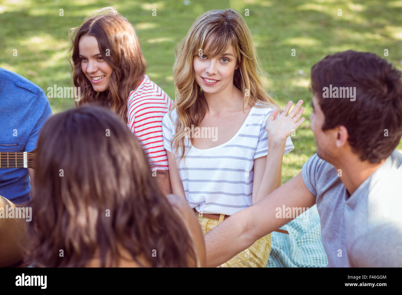 Happy friends in a park Stock Photo - Alamy