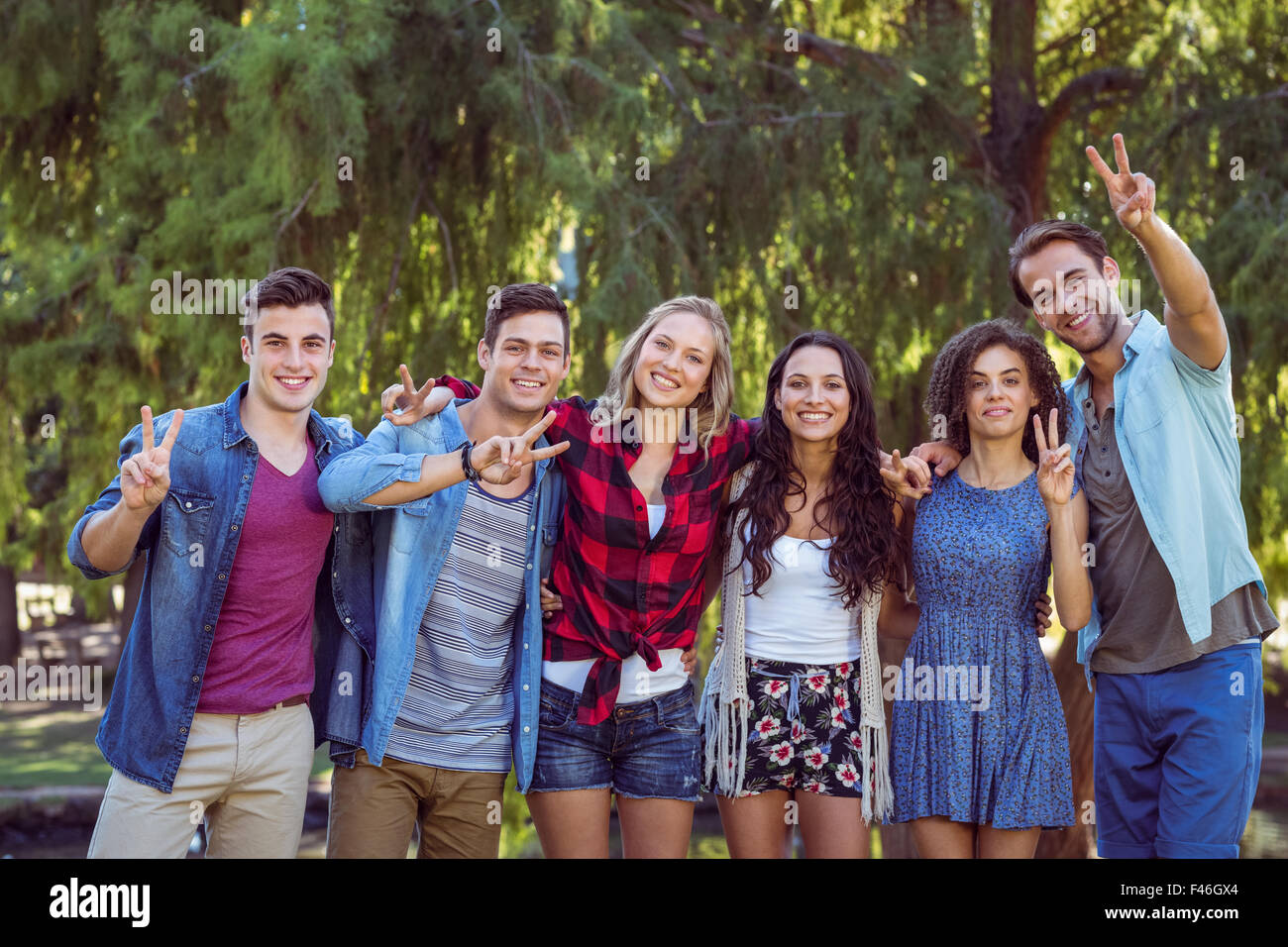 Happy friends in the park Stock Photo - Alamy
