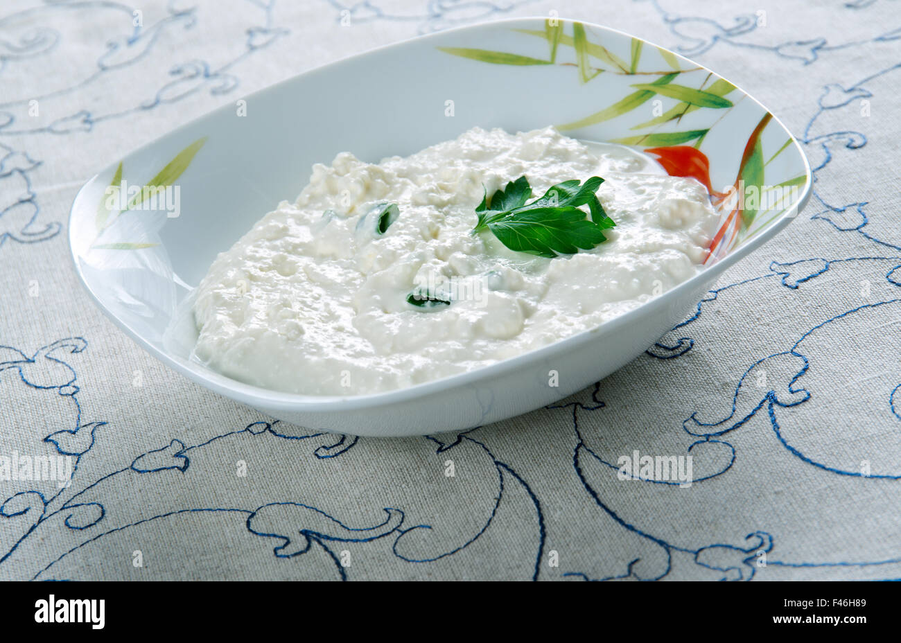 Moretum - herb cheese spread that the Ancient Romans. made of herbs, fresh cheese, salt, oil and some vinegar. Stock Photo