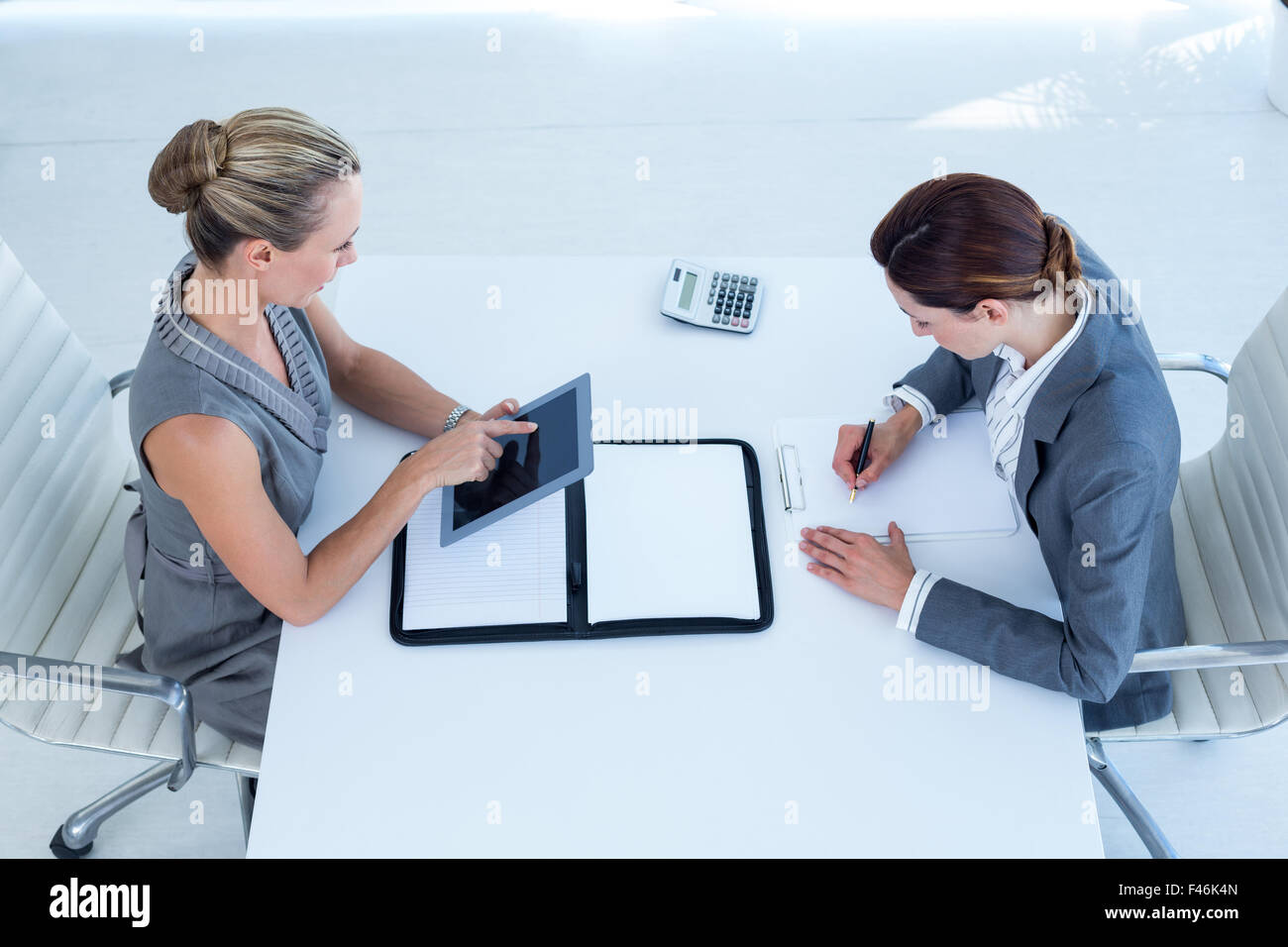 Businesswomen working together Stock Photo - Alamy