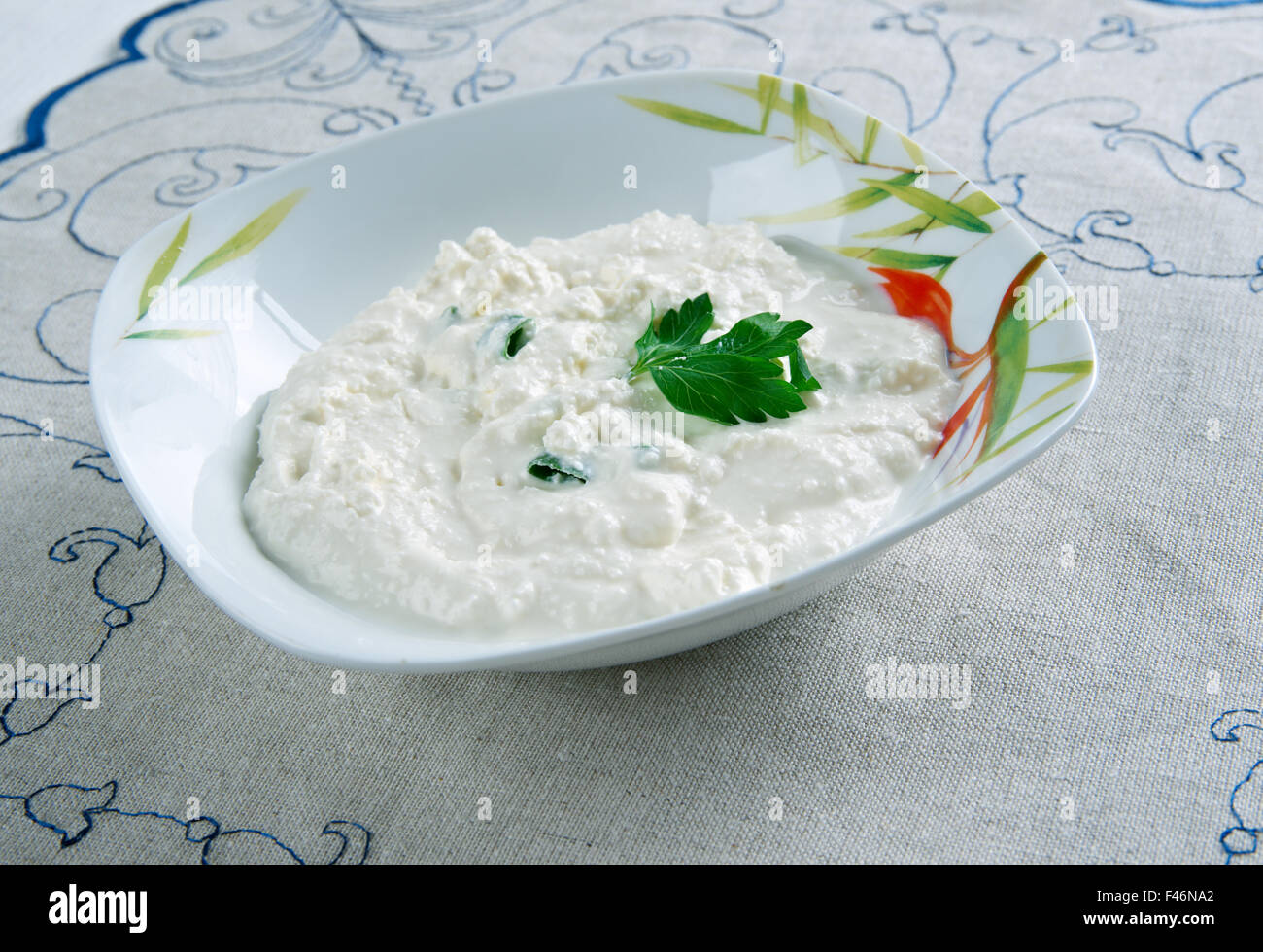 Moretum - herb cheese spread that the Ancient Romans. made of herbs, fresh cheese, salt, oil and some vinegar. Stock Photo