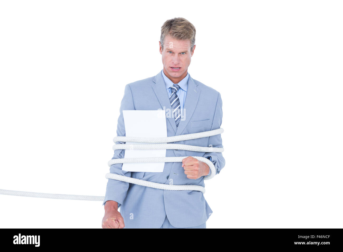 Serious businessman tied up at work Stock Photo Alamy