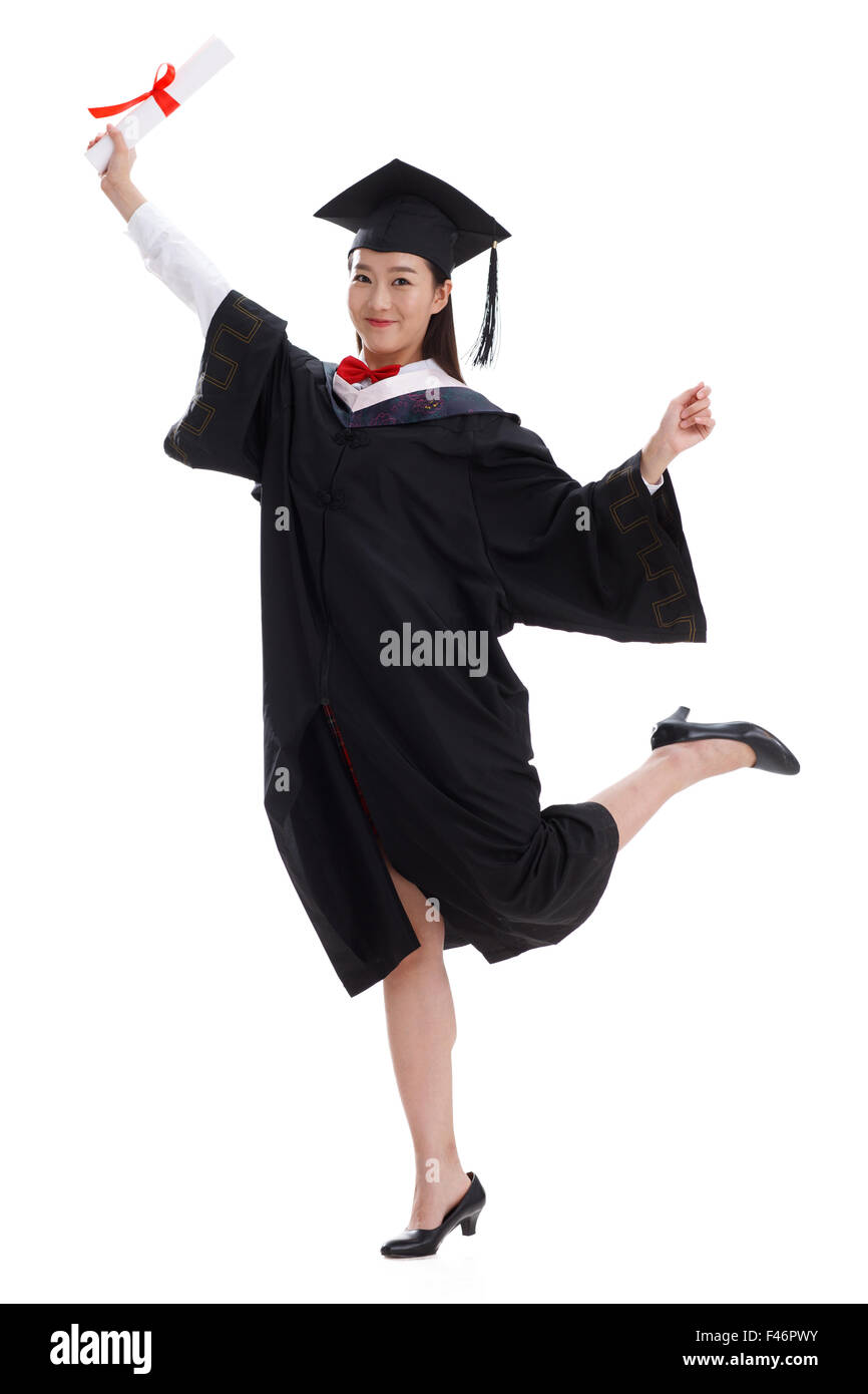 Smiling graduate holding diploma Stock Photo