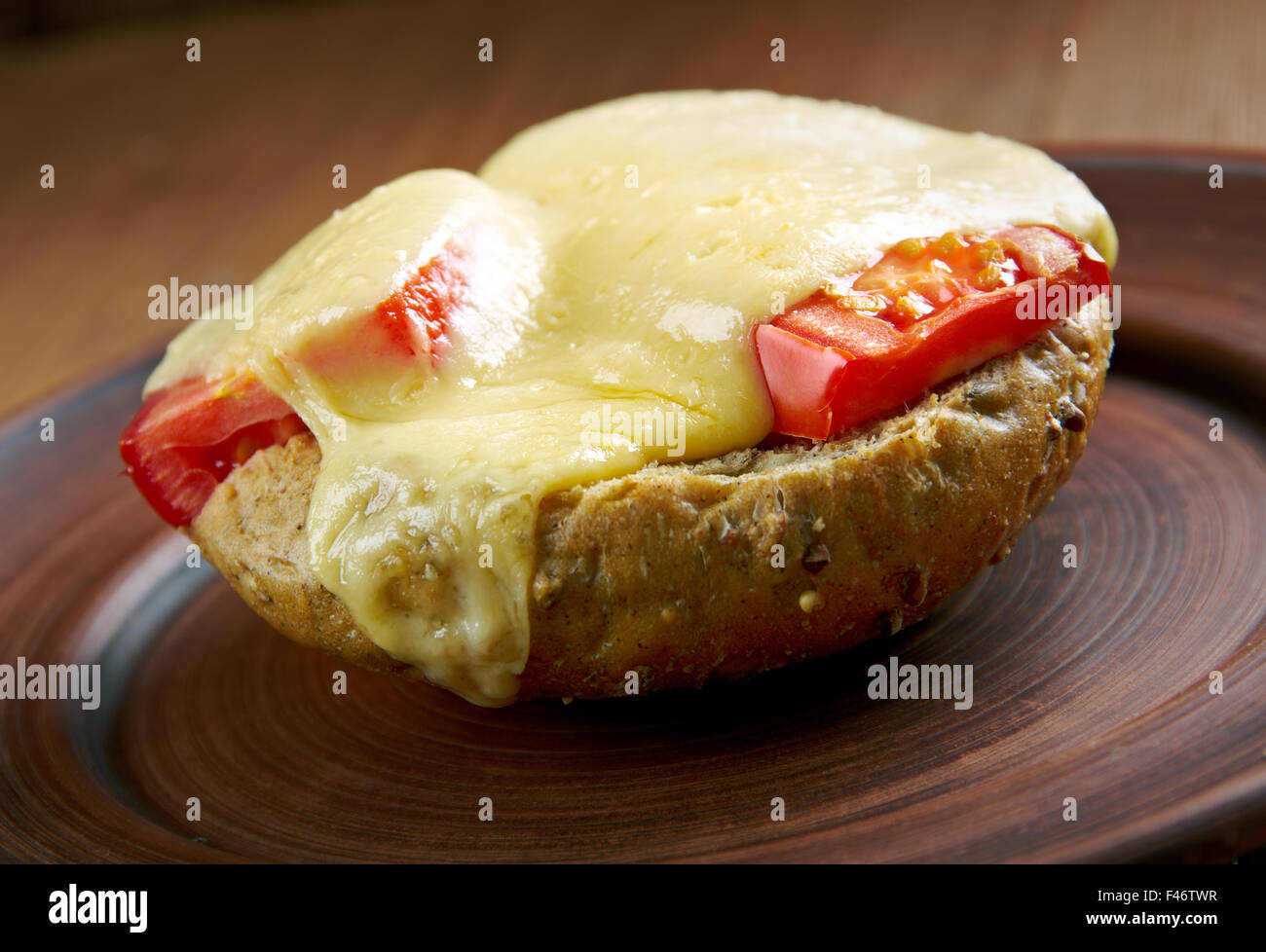 Irish rarebit - dish made with a savoury sauce of melted cheese of toasted bread.British cuisine Stock Photo