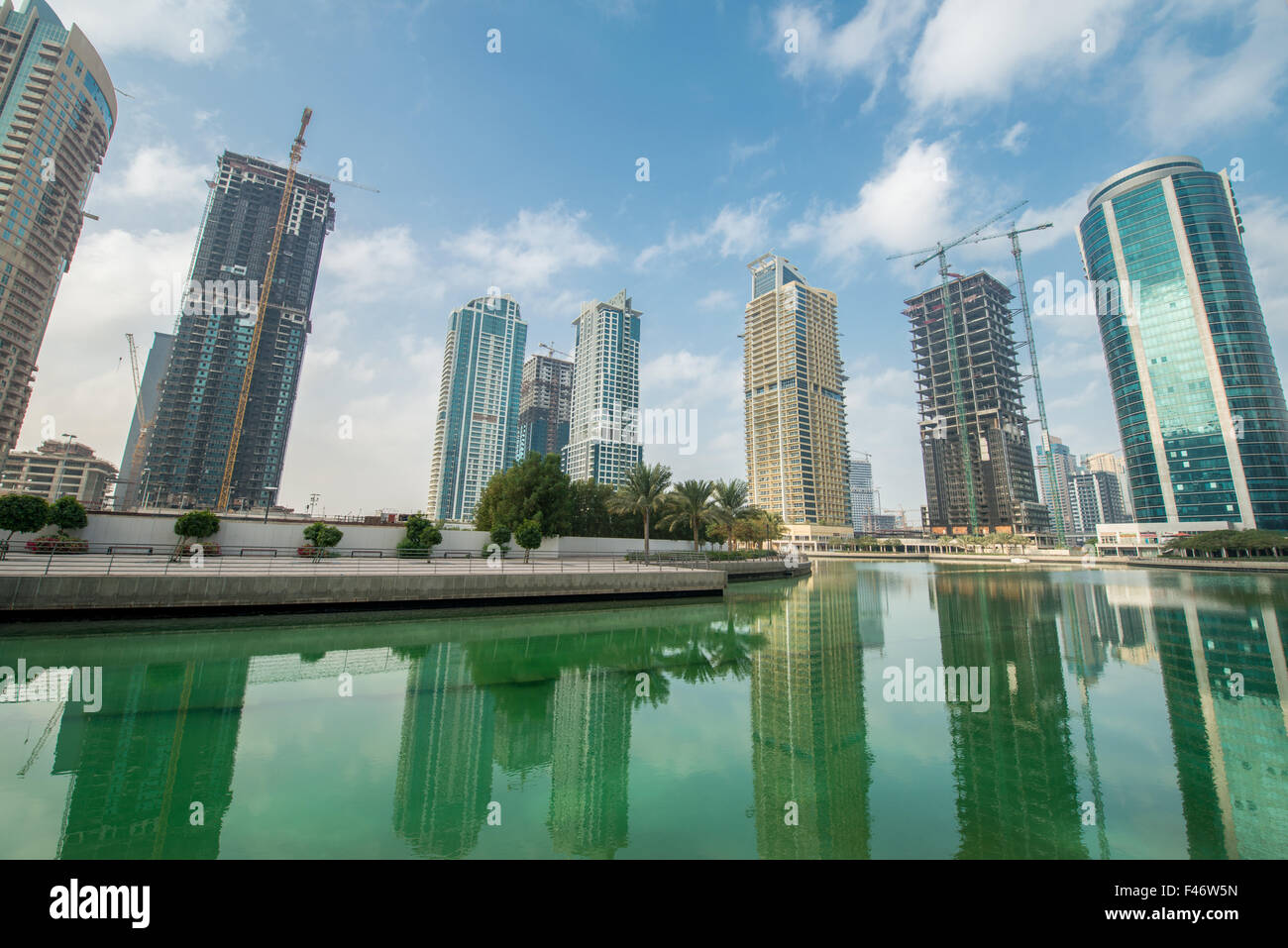 Tall skyscrapers in Dubai near water Stock Photo