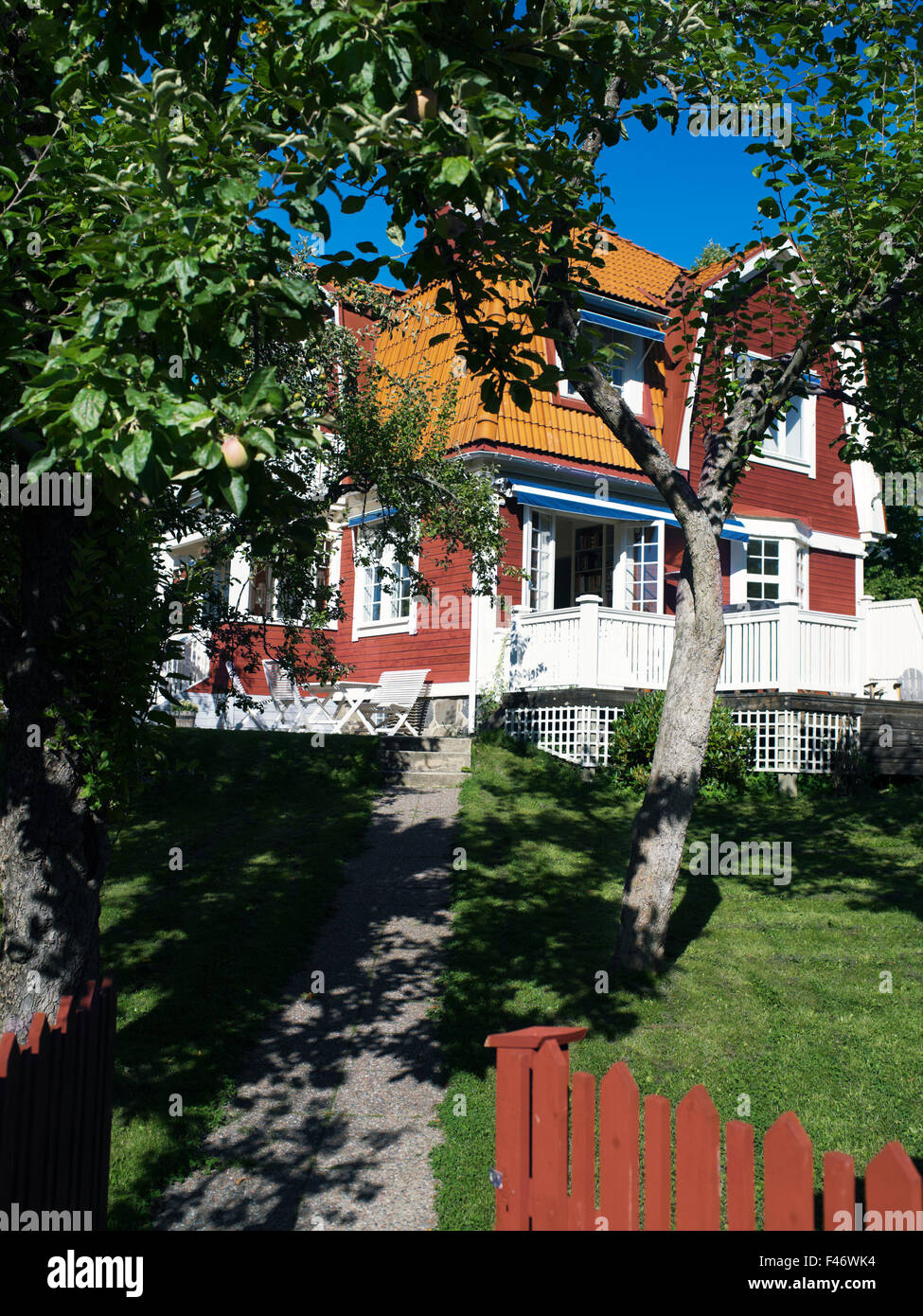 A red house in a garden, Sweden. Stock Photo