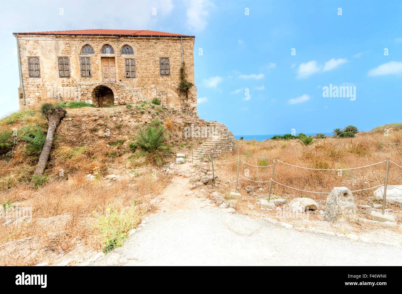 The remains of a traditional Lebanese house at the ancient and historical site of the Crusaders' castle in Byblos, Lebanon. It a Stock Photo