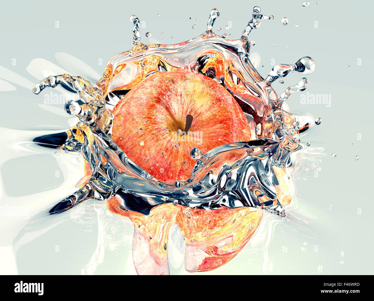 red apple faling and splashing into clear water Stock Photo