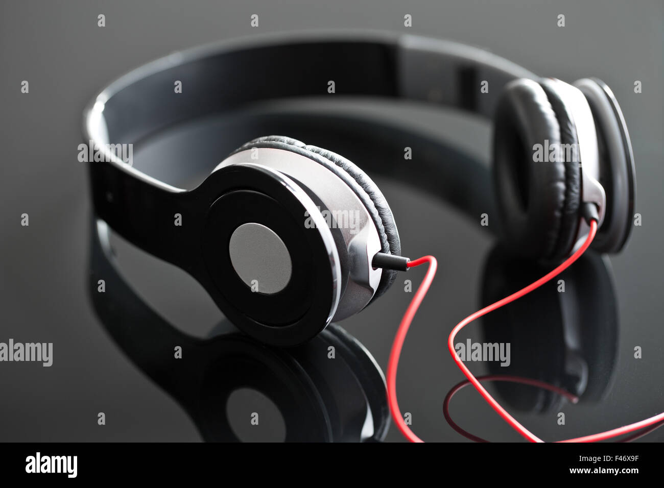 the headphones on black table Stock Photo Alamy