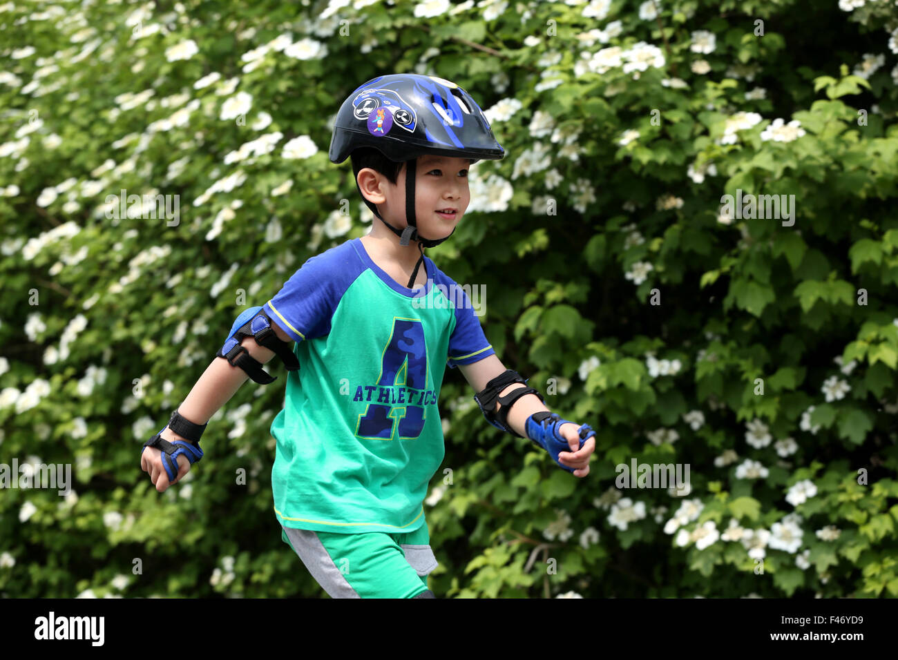 Boy inline skating outdoors Stock Photo Alamy
