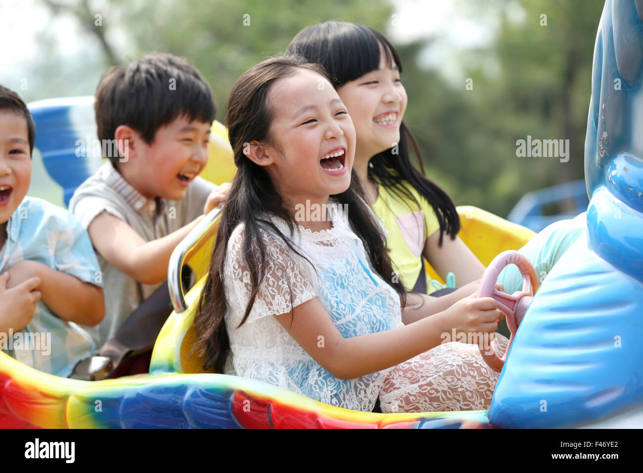 Children at amusement park Stock Photo