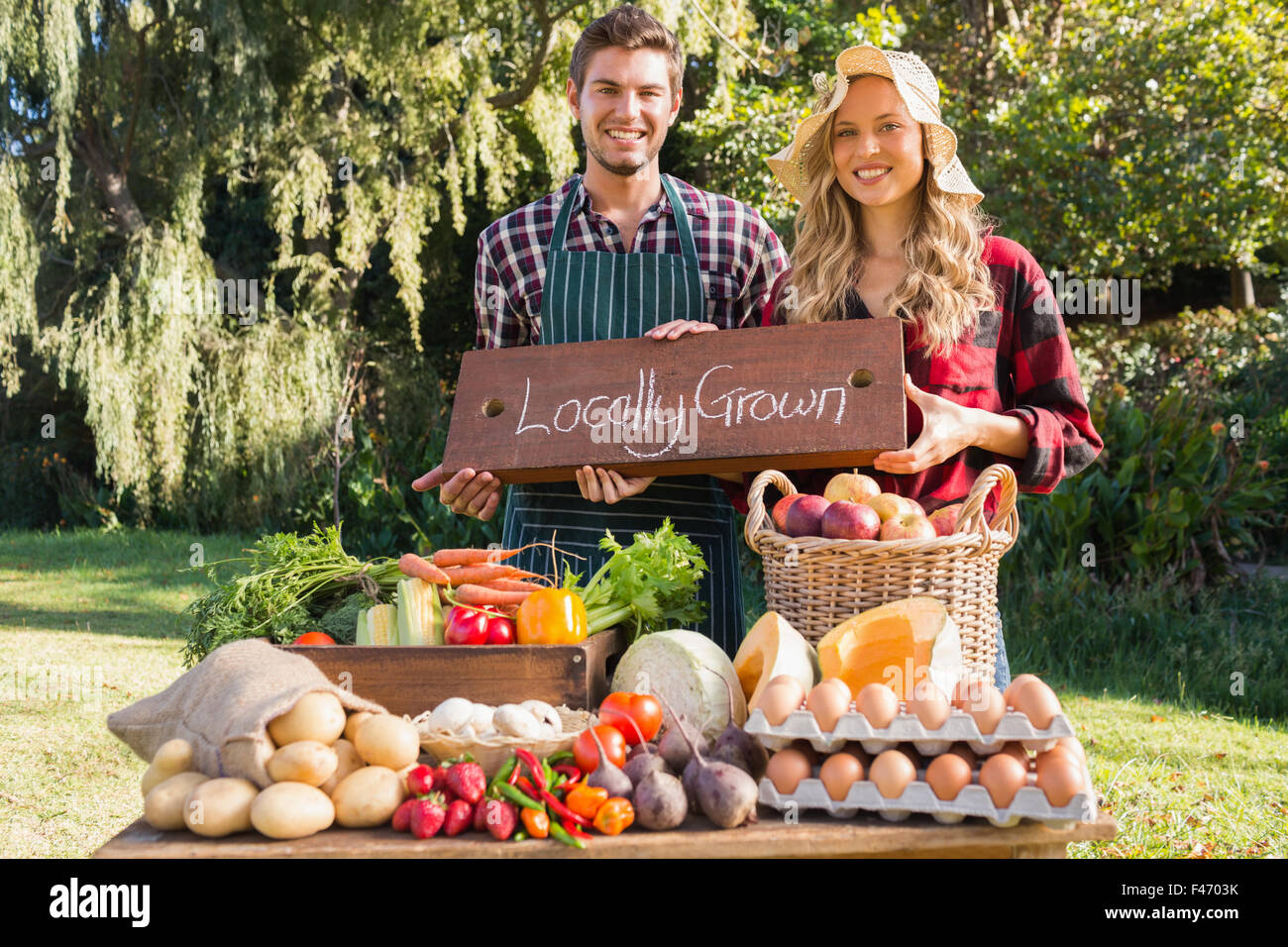 Young man selling vegetables hi-res stock photography and images - Alamy
