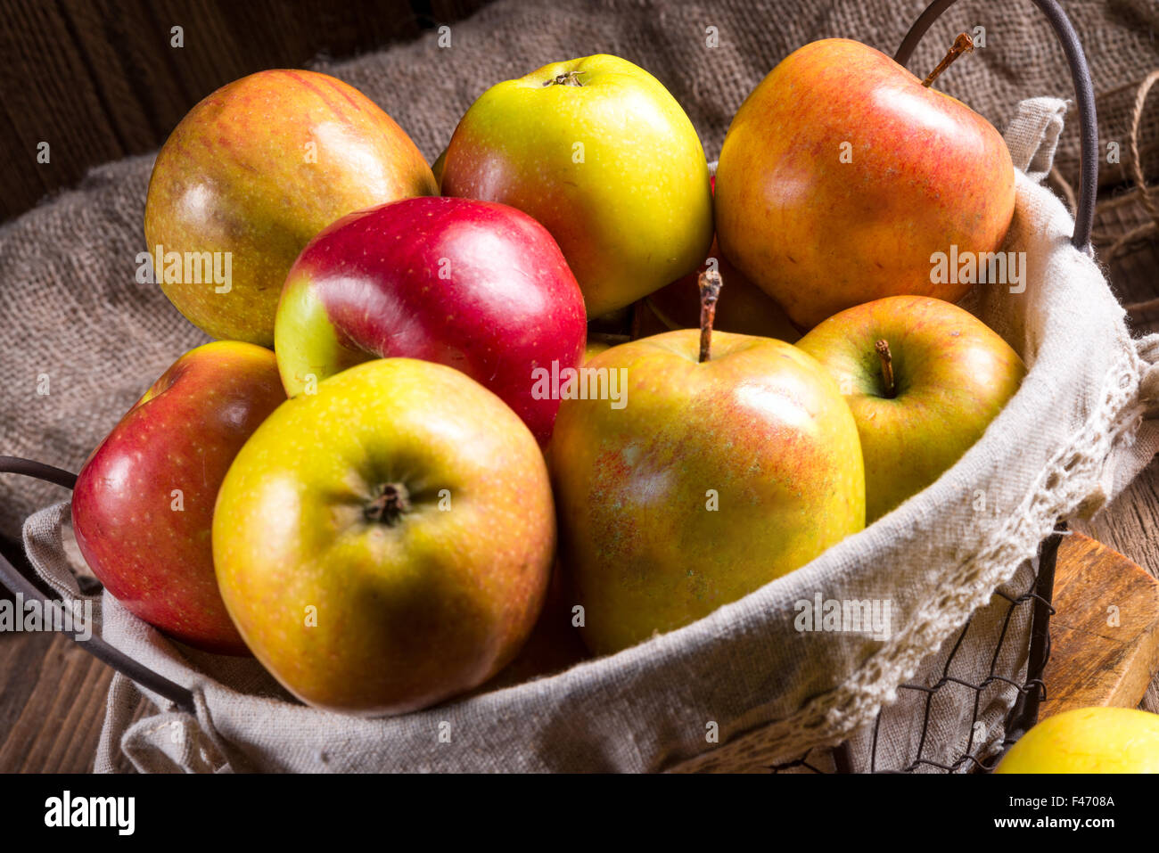 Fresh autumn apples in the basket Stock Photo