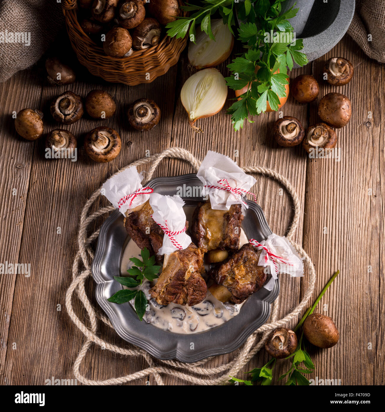 Grilled rinderrippchen with mushroom sauce Stock Photo - Alamy