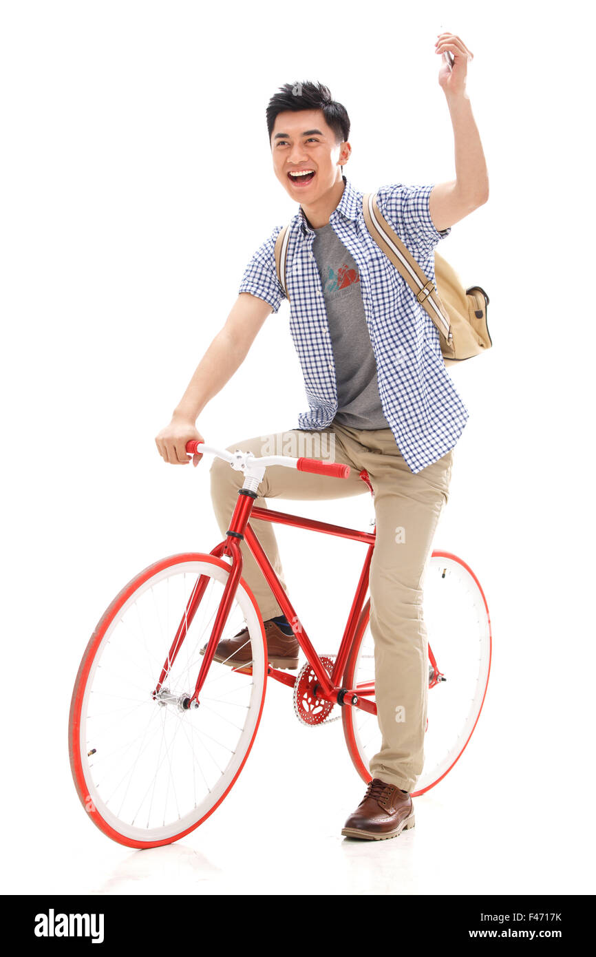Young man riding a bicycle Stock Photo