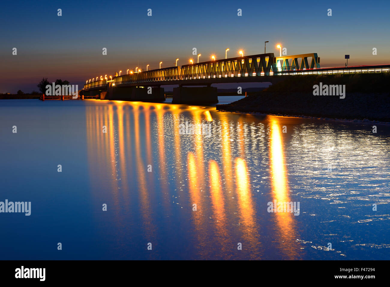 Bascule bridge spanning Peenestrom at night, Usedom Island, Mecklenburg-Western Pomerania, Germany Stock Photo