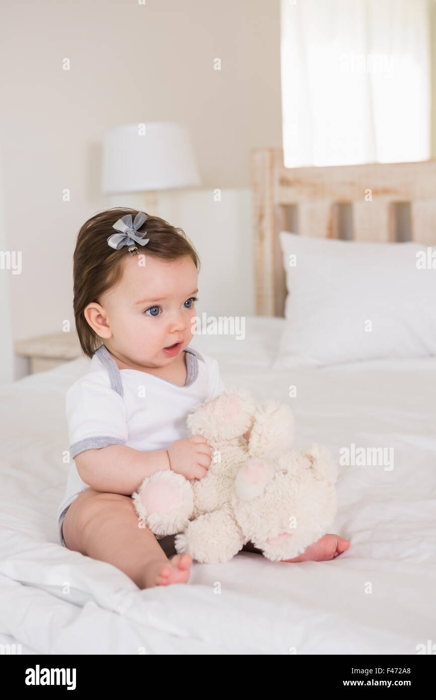 Beautiful cute baby girl with her teddy bear Stock Photo - Alamy