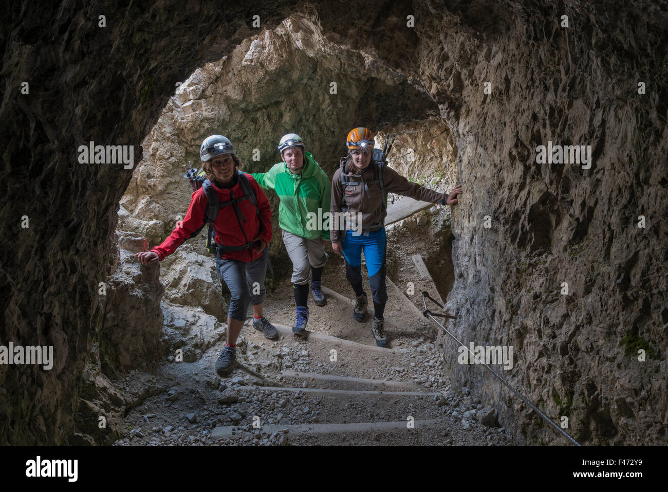 Tourists in the rock tunnel, WWI openair museum, long steep tunnel