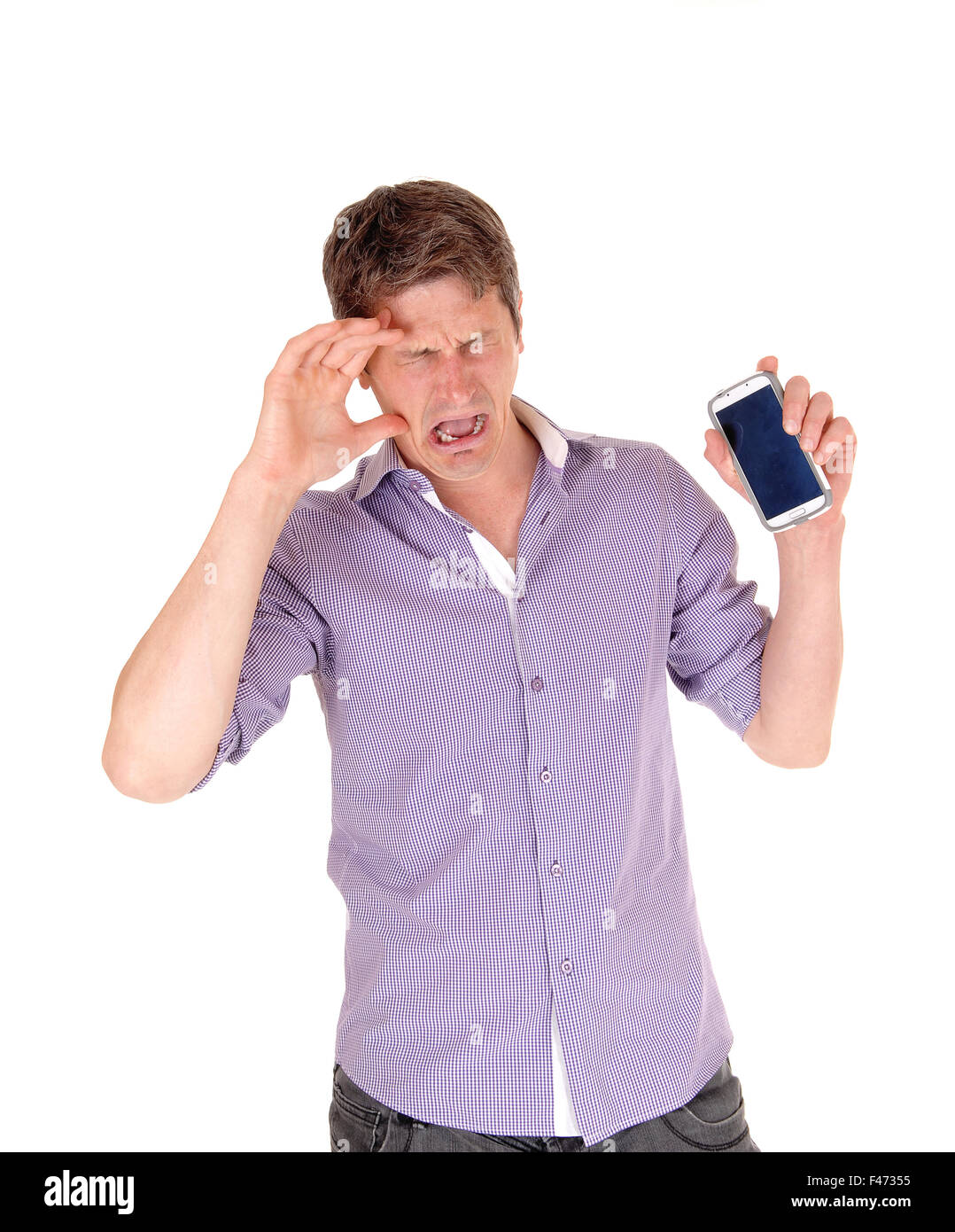 Man crying for broken phone. Stock Photo