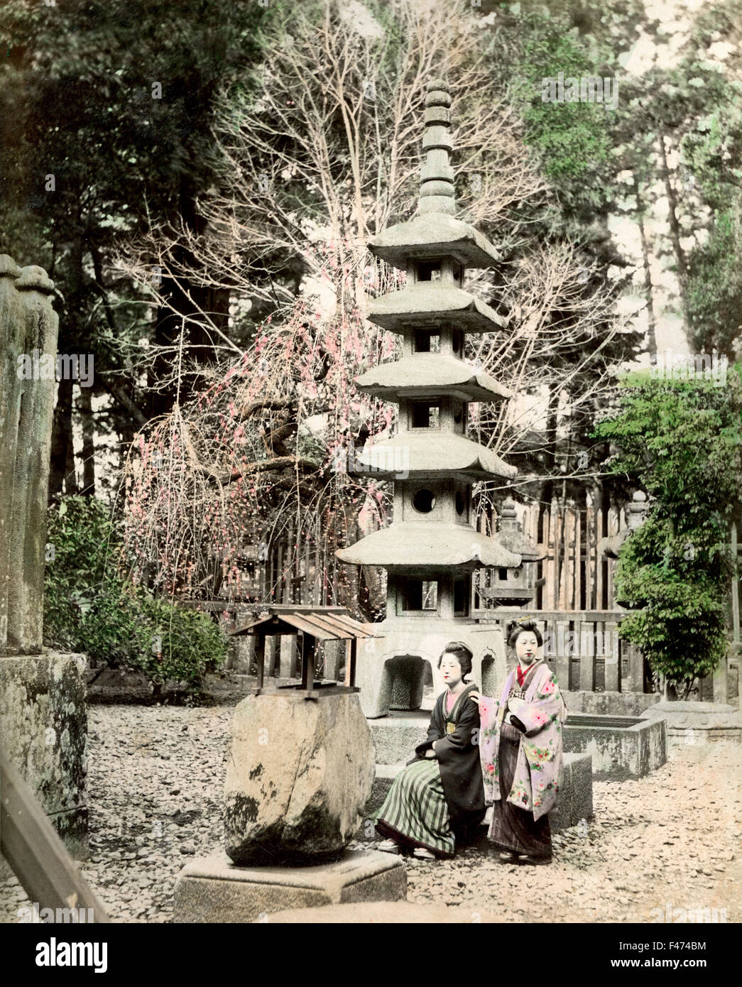 Two women in shrine, Japan Stock Photo