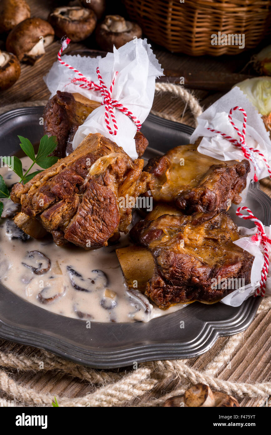 Grilled rinderrippchen with mushroom sauce Stock Photo - Alamy