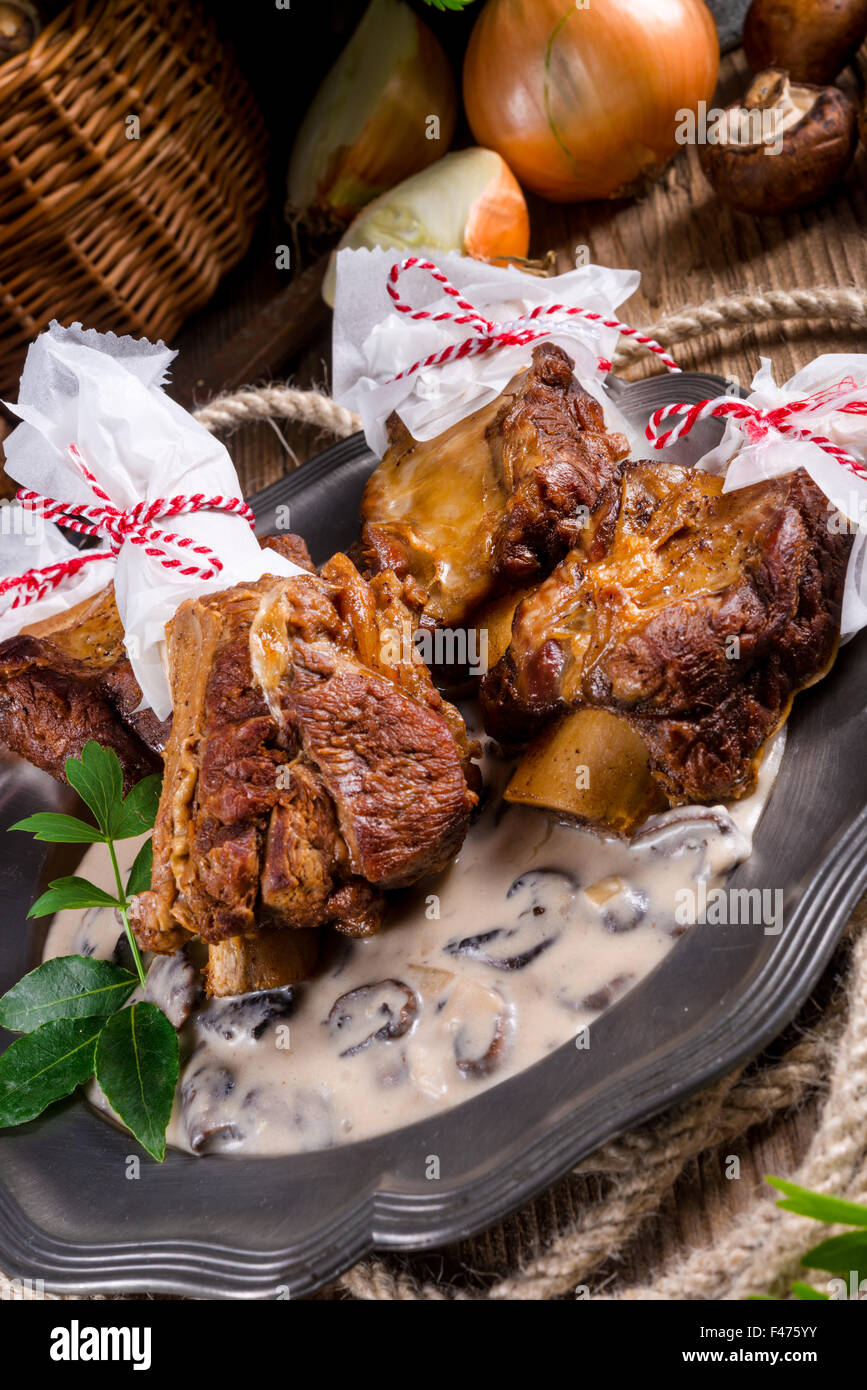Grilled rinderrippchen with mushroom sauce Stock Photo - Alamy