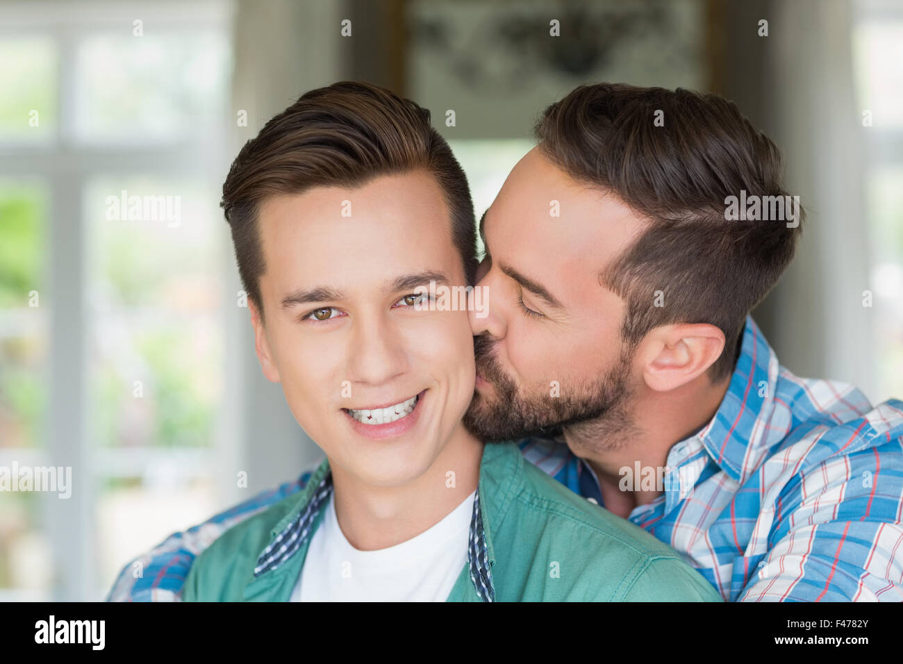 Homosexual couple men kissing each other Stock Photo