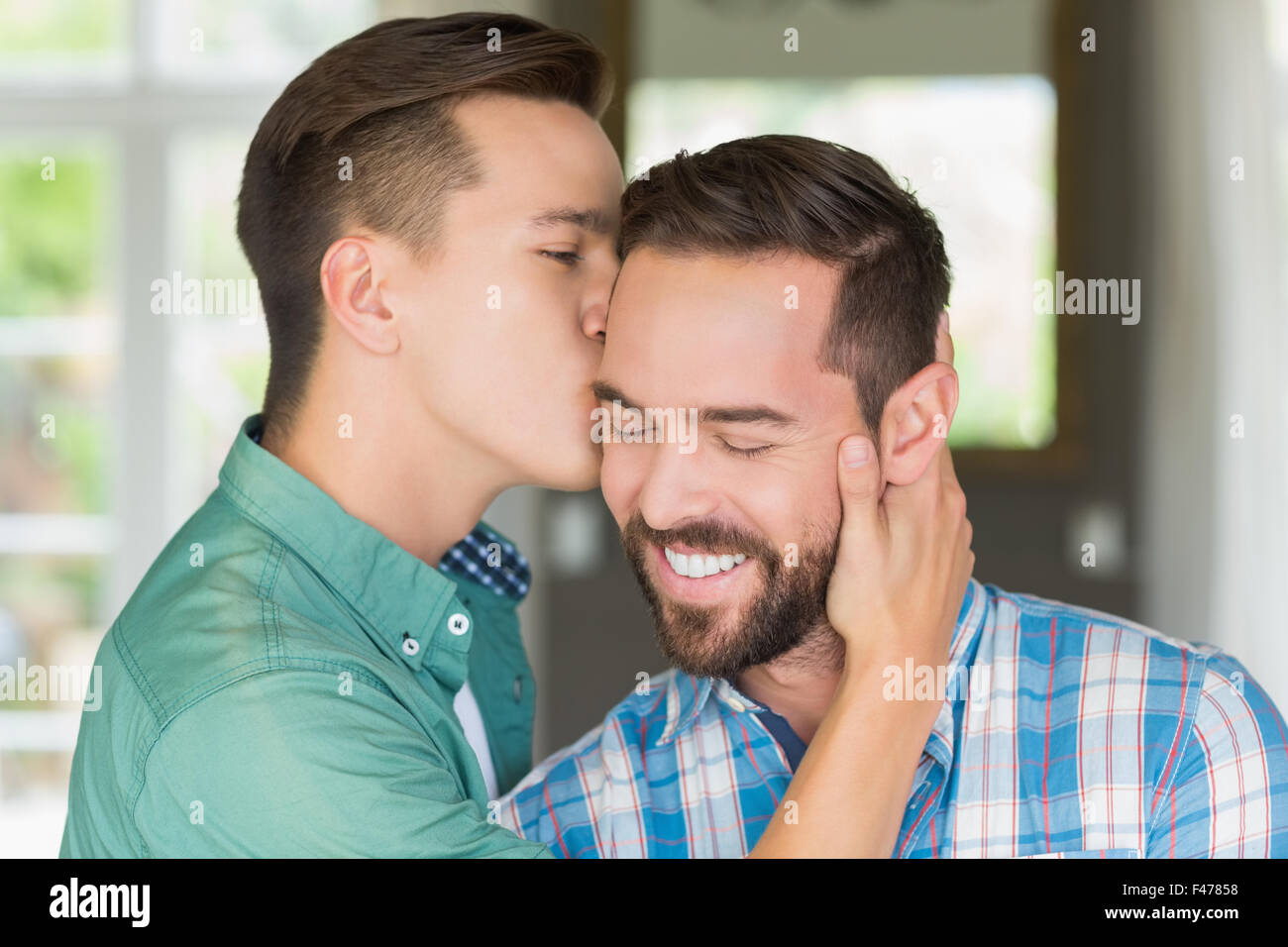 Homosexual couple men kissing each other Stock Photo