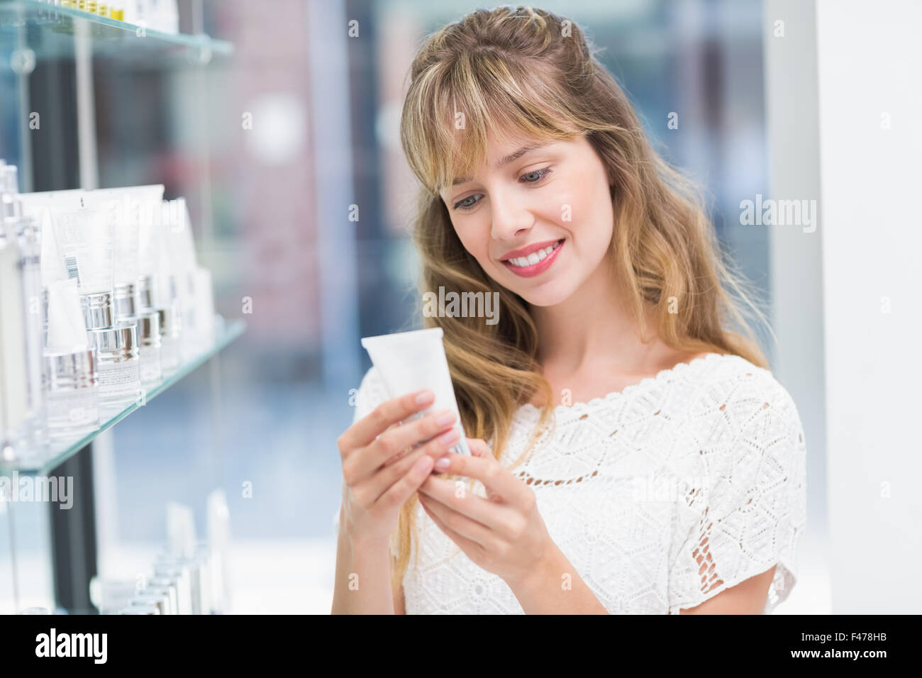 Beautiful costumer looking at product Stock Photo - Alamy