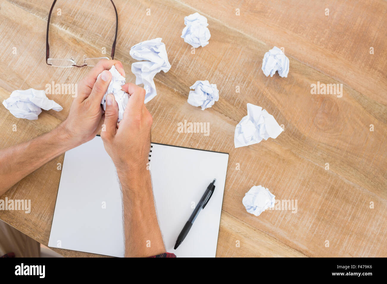 Hands crushing a paper pellet Stock Photo Alamy