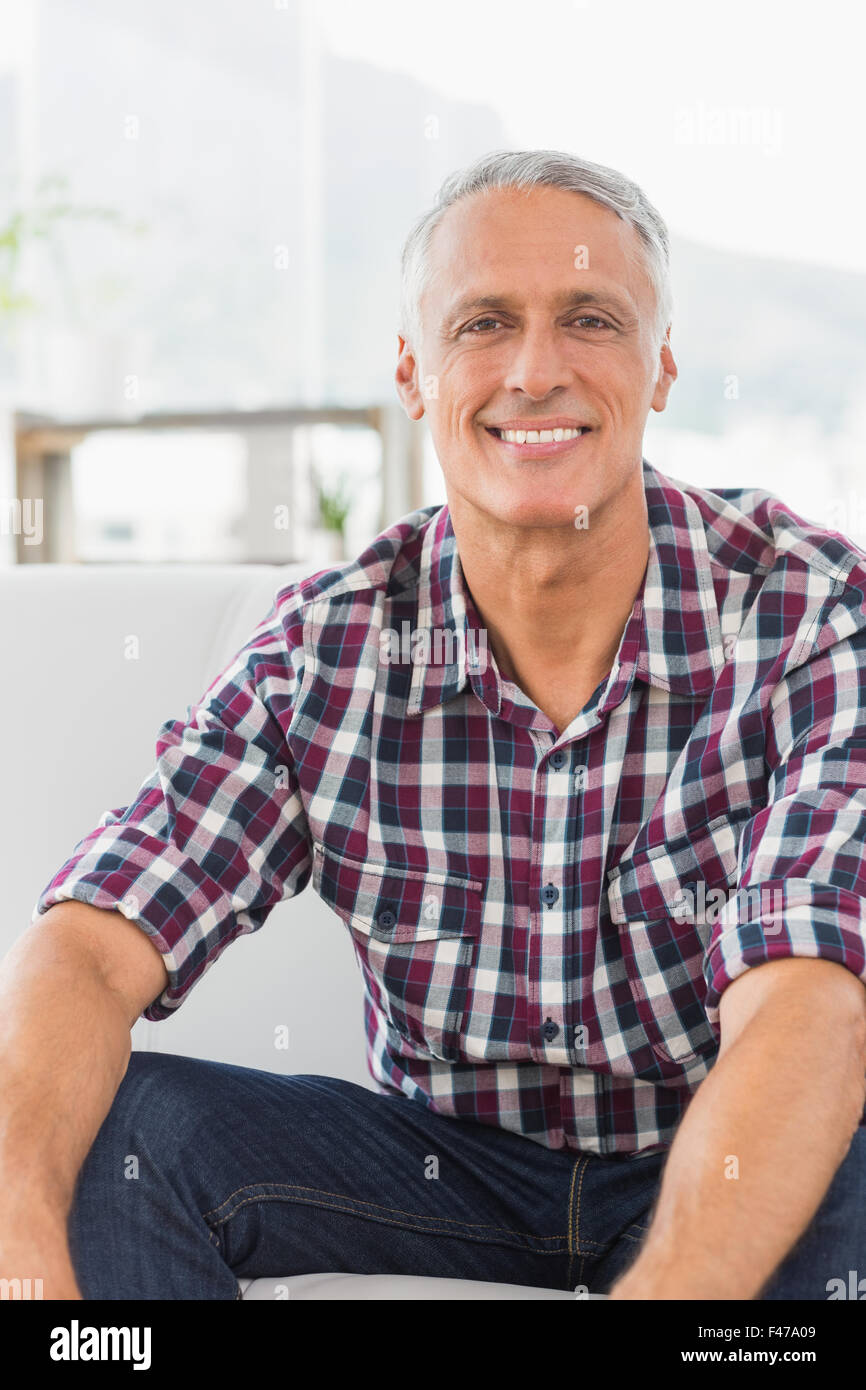 Smiling businessman looking at camera Stock Photo - Alamy