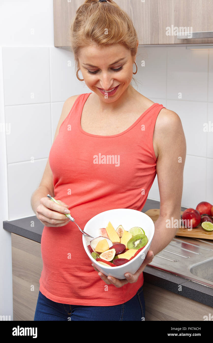 PREGNANT WOMAN EATING Stock Photo