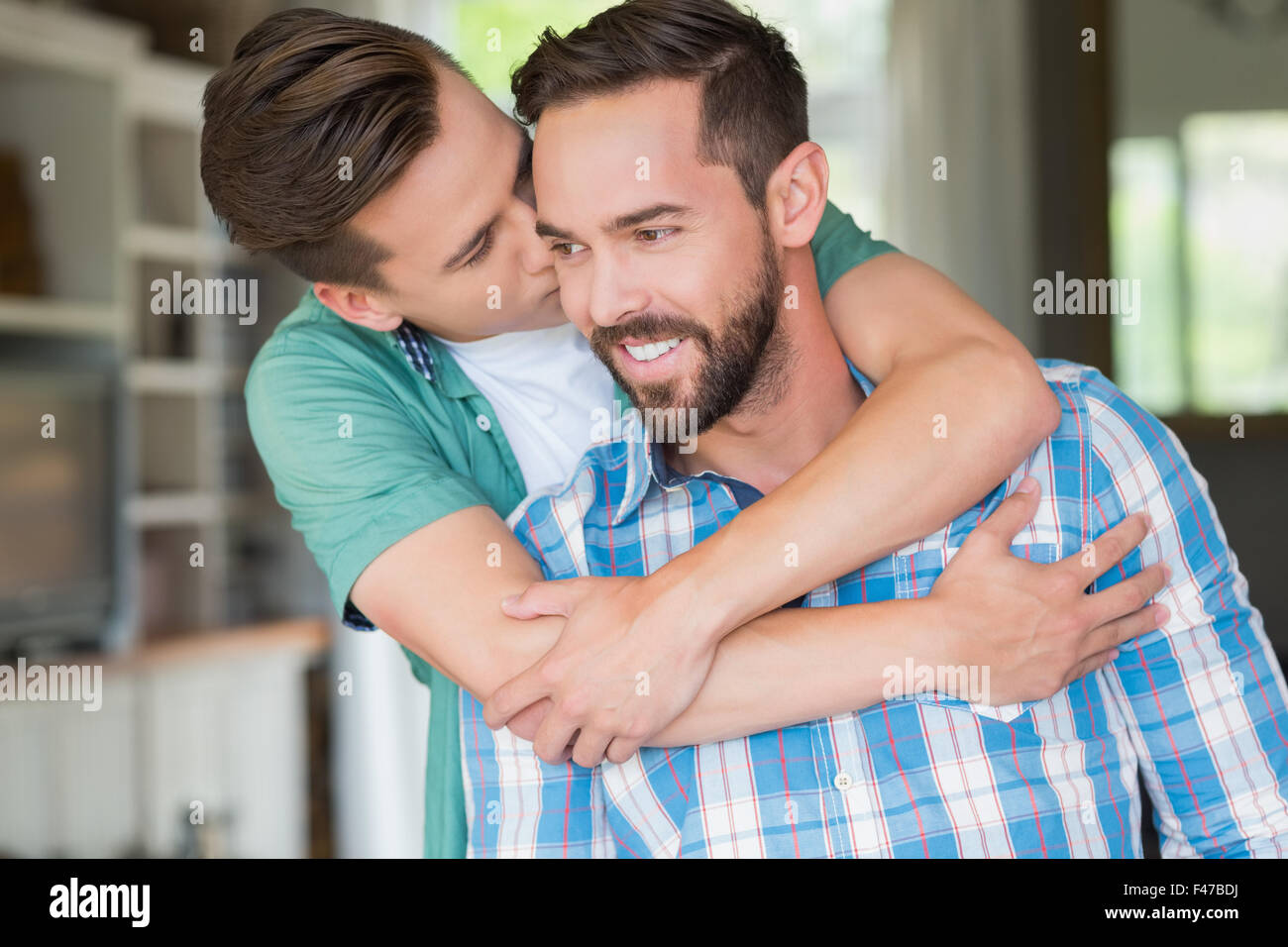 Homosexual couple men kissing each other Stock Photo