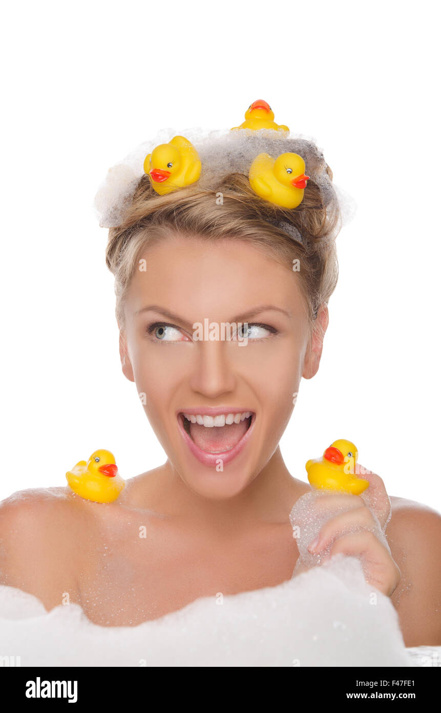 woman with ducks and soap suds looking away Stock Photo